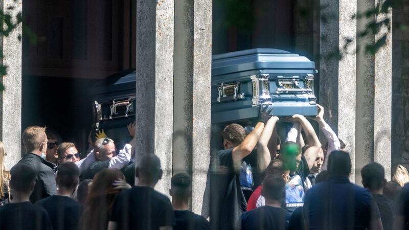 The remains of Dean Maguire are carried from the church after funeral Mass. Photograph: Collins