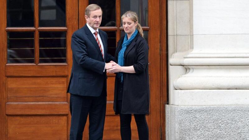 Taoiseach Enda Kenny with Maíria Cahill  leaving Government Buildings last month.  Photograph: Eric Luke/The Irish Times