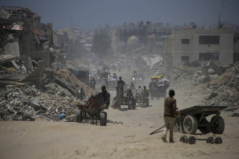 Internally displaced Palestinians leaving Khan Younis with their belongings following an evacuation order by the Israeli army. Photograph: Mohammed Saber/EPA