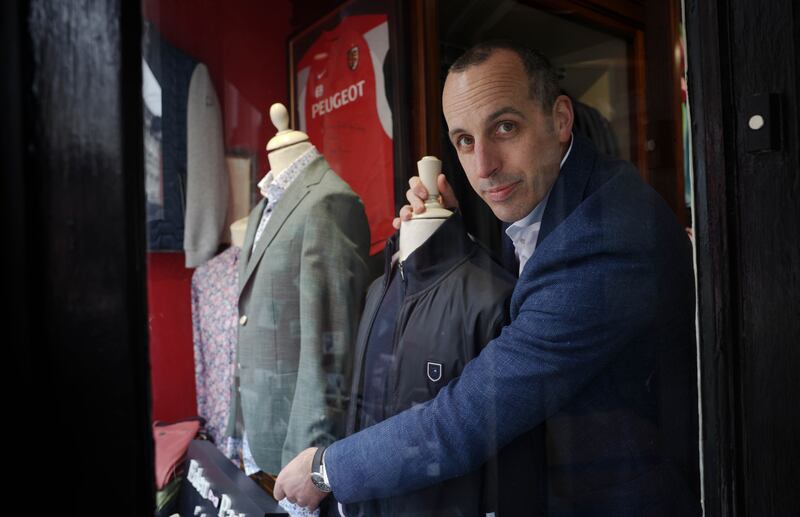  “Of my sales last year, 80 per cent were occasion-driven.” - Paddy Sheary adjusts the display in his menswear shop on Clarendon Street in Dublin. Photograph : Laura Hutton 