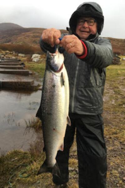 French angler Patrick Duperat displaying a fine salmon of 11lb caught by his wife Chlo while trolling on Lough Currane. Photograph: Vincent Appleby