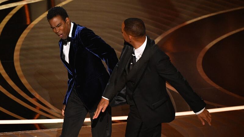 Will Smith slaps Chris Rock onstage at the Oscars last year. Photograph:  Robyn Beck/AFP via Getty