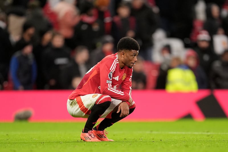 Manchester United's Amad Diallo stands dejected. Photograph: Martin Rickett/PA