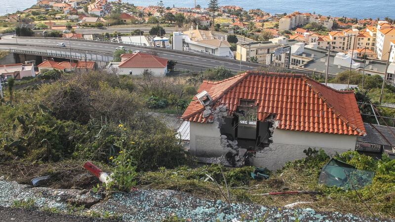 The wall of a house which was damaged after the bus carrying German tourists veered off the road. The crash left 29 people dead. Photograph: Honem Gouveia