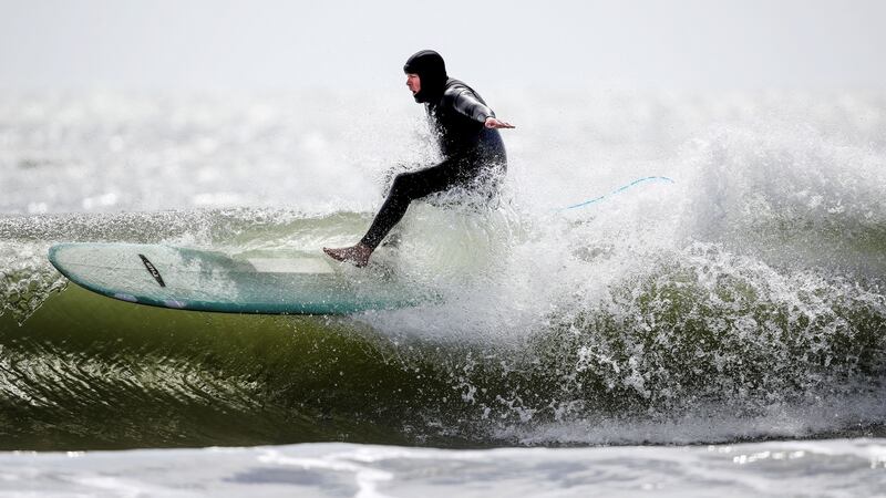 There have been opportunities to take different types of photos such as this one of surfers on Ballymoney Beach last week. Photo: Dan Sheridan/Inpho