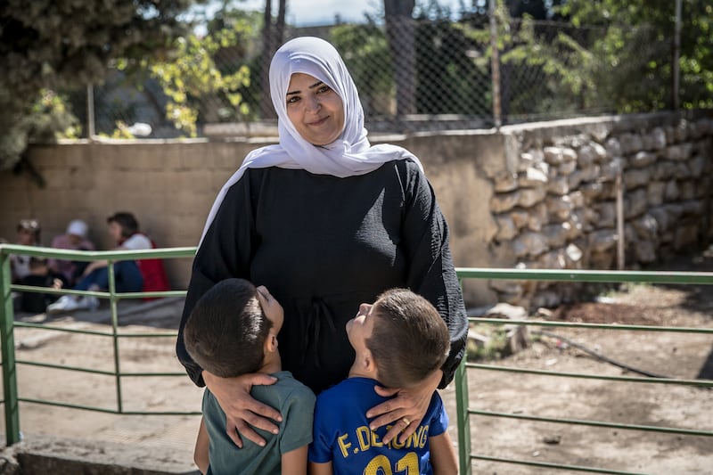 Rima and her two boys in a displacement shelter in northern Lebanon during the war. Photograph: Sally Hayden