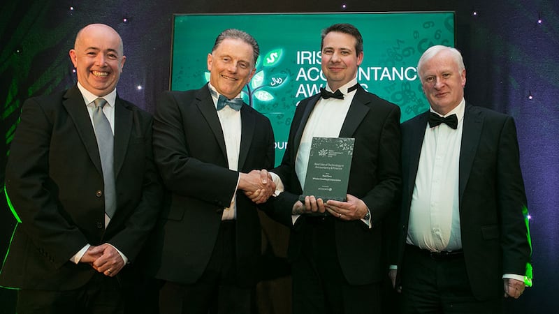 Tony Connolly, CEO, AccountsIQ presents the Best Use of Technology in Accountancy & Finance award to Brendan Killcoch, Jason Dowling and Sean Whelan, Whelan Dowling & Associates