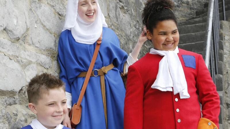 Family fun: enjoy a day of history at St John’s Castle in Limerick city like Paul Lyons(11) and Titiana Ayawe (10), who are dressed in period costume, with Maria Larkin from King John’s Castle. Photograph: Liam Burke/Press 22