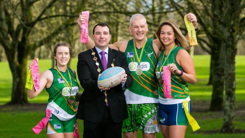 Paul Clinch, Men's over 50s Irish tag rugby team, with Ellen O’Sullivan and Lesley Walsh, members of the Women’s Irish tag rugby team, and Cllr James Collins, the  former mayor of Limerick City and County. '“I would have loved the cap at the time,” says Clinch. “But I’m delighted to get one now.'
Photograph: Oisín McHugh/True Media