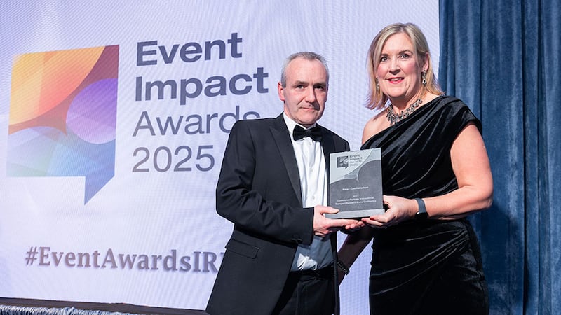 Maria Roddy Freyne, awards judge, presents the best conference award to Colm O'Grady, Conference Partners International