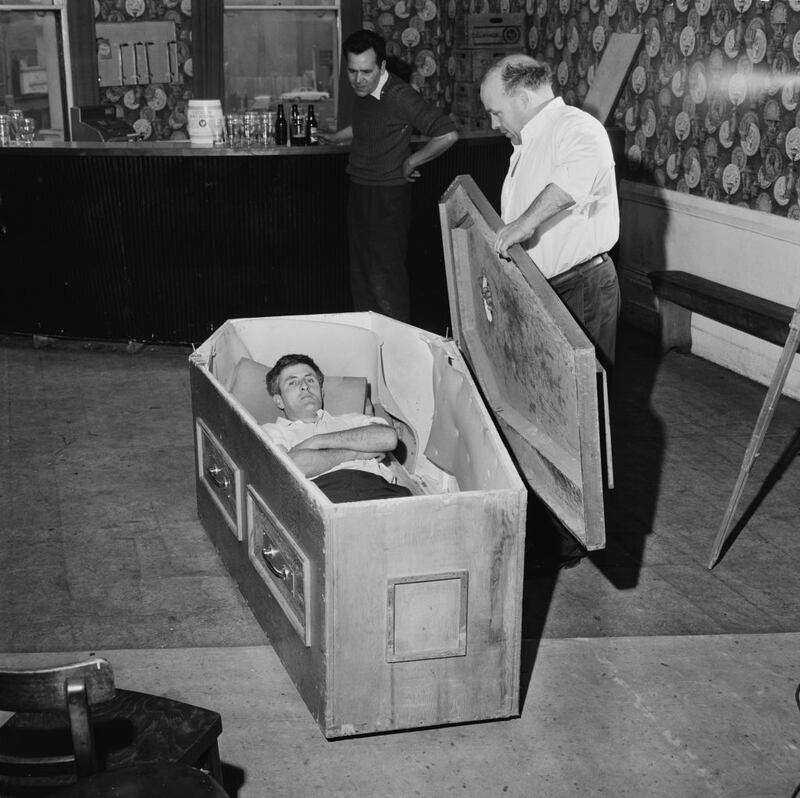 The Admiral Nelson pub in Kilburn, north London. Michael 'Butty' Sugrue puts the lid on the specially-made coffin of 33 year-old Irish builder Mick Meaney in 1968. Photograph: Chris Ware/Keystone Features/Hulton Archive/Getty Images