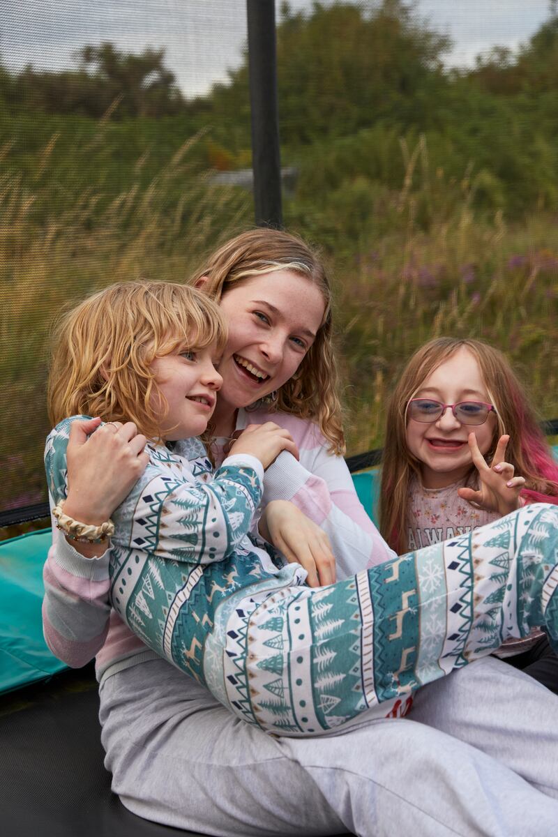 Orla Mac Connell with her sister Annie (middle) and Lucy (on right). Photo: Lisa Bennett