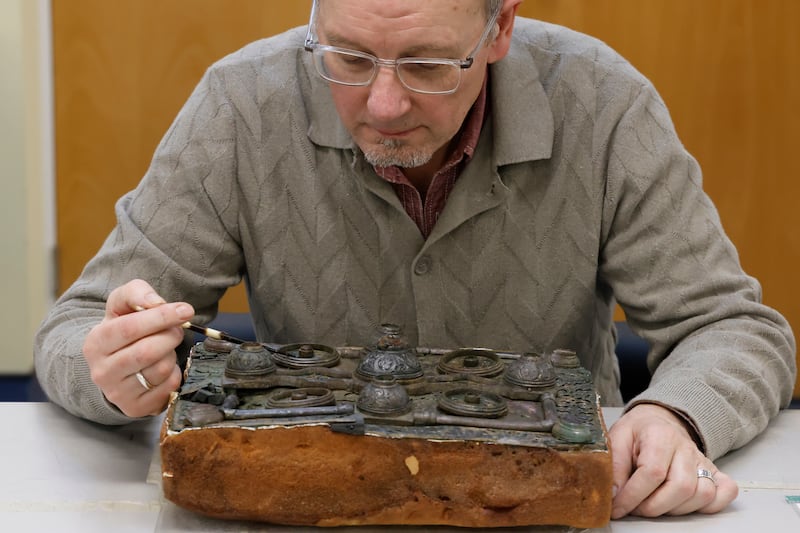 Paul Mullarkey works on the Kinale book shrine. Photograph: Nick Bradshaw