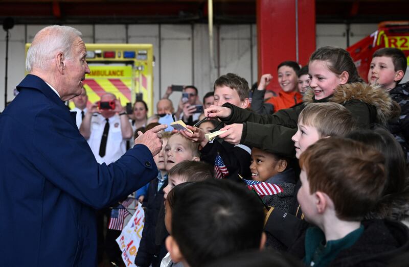 US president Joe Biden is greeted by embassy staff and their family upon arrival at the Dublin Airport. Photograph: Jim Watson/AFP