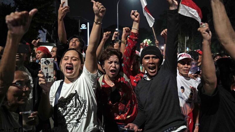 Supporters of Joko Widodo, Indonesia’s president, celebrate on the streets in Jakarta, Indonesia. Unofficial vote counts point to a second term for Widodo. Photograph: Dimas Ardian/Bloomberg