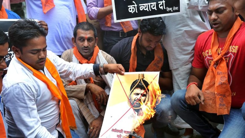 Activists from hardline organisation Hindu Sena burn posters and shout slogans in support of the death sentence for Yakub Memon.  Photograph: Harish Tyagi/EPA