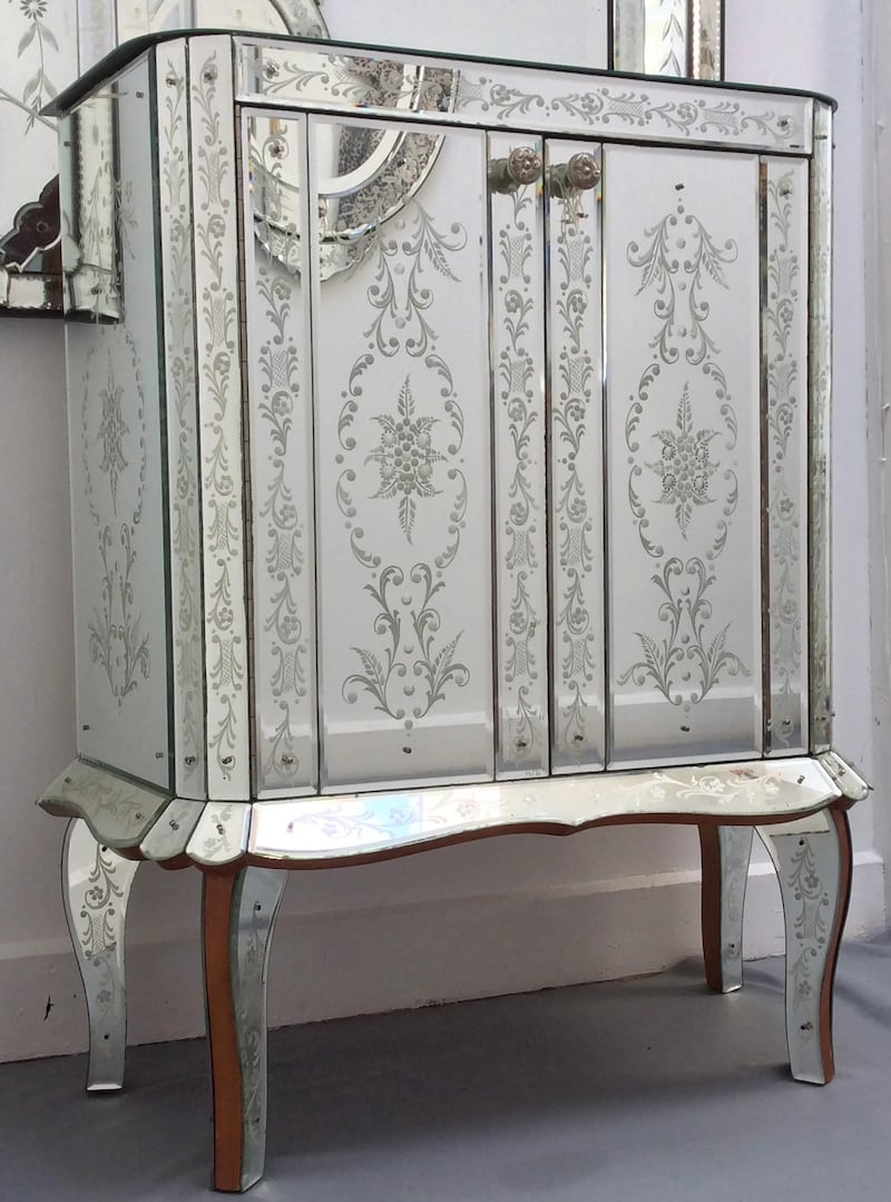 French art deco drinks cabinet, €3,000-€5,000, with a silver-painted floral exterior and mirrored and fitted interior