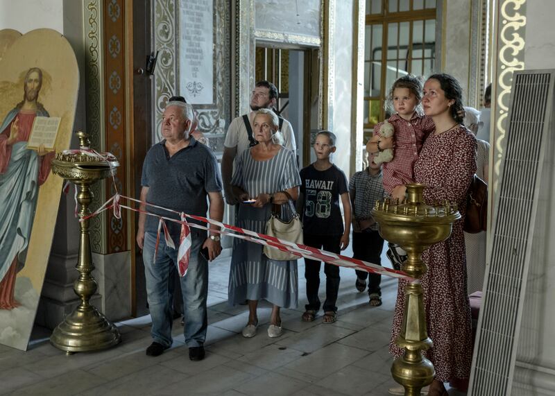 Residents viewing damage from Russian missiles inside the Odesa Transfiguration Cathedral in Odesa, Ukraine. Photograph: Emile Ducke/The New York Times
                      