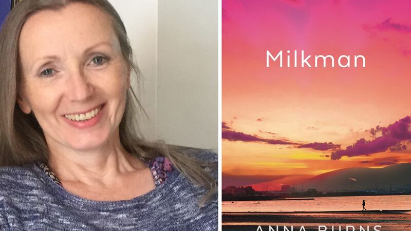 Anna Burns with the cover of her novel Milkman, which has been shortlisted for the 2018 Man Booker Prize.