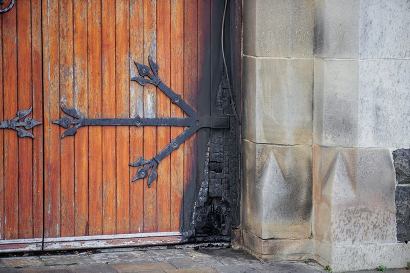 Damage to a church door at Our Lady and St Patrick's Catholic Church in the Castle Street area of Ballymoney. Photograph: Liam McBurney/PA Wire