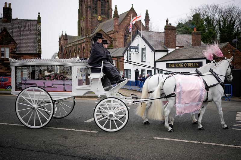 The coffin of Brianna Ghey arrives by a horse-drawn carriage at St Elphin's Church in Warrington. Photograph: Christopher Furlong/Getty