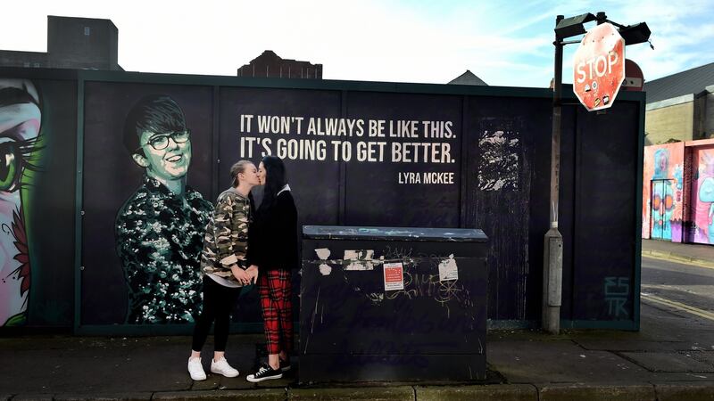 Robyn Peoples and Sharni Edwards in front of the Lyra McKee mural in Belfast. The couple will be the first same-sex couple to get married in Northern Ireland. Photograph: Charles McQuillan/Getty