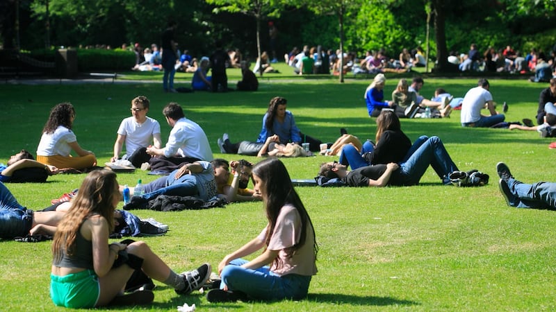 People enjoying the good weather in St Stephens Green in Dublin. Photograph: Collins