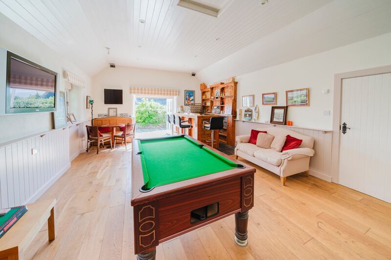 Annexe is laid out with a bar and games room