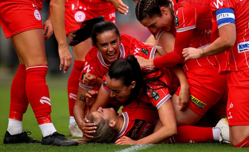 Shelbourne’s Kate Mooney celebrates after scoring the first goal of the game with her teammates. Photograph: Ryan Byrne/Inpho