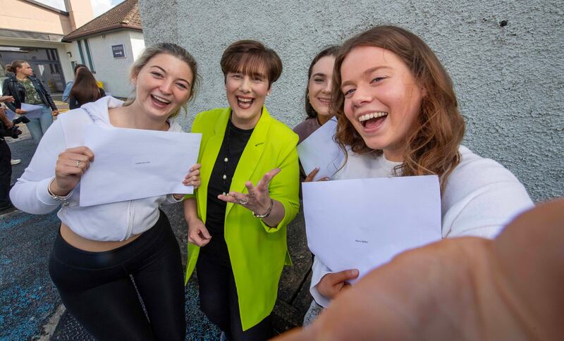 Minister for Education Norma Foley with students Luke Power and Anthony Dowling from St Michael's, Listowel, Co Kerry. Photograph:Domnick Walsh