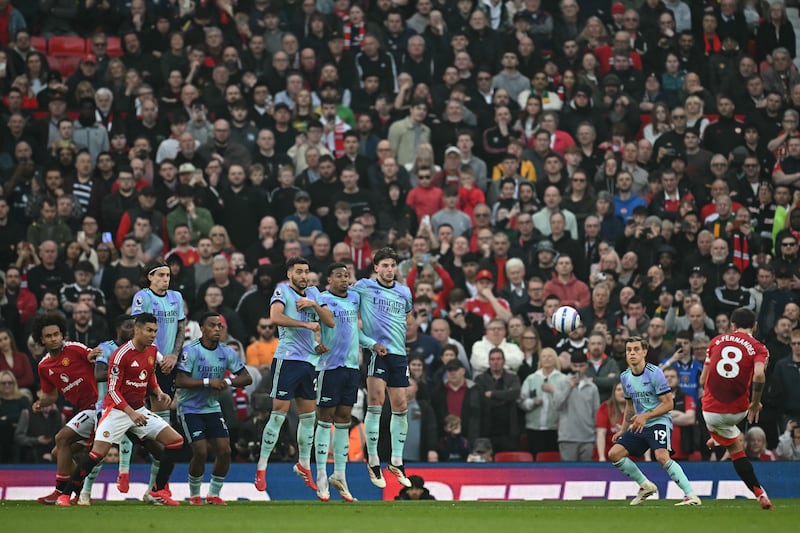 Manchester United's Bruno Fernandes curls a freekick towards the Arsenal goal, which David Raya did not protect very well. Photograph: Paul Ellis/AFP via Getty Images