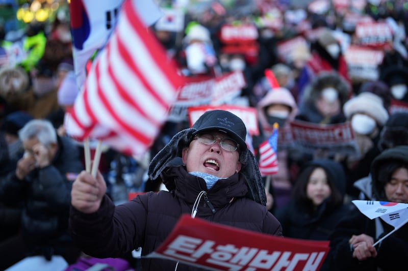 Supporters of impeached South Korean president Yoon Suk Yeol staging a rally to oppose a court warrant for his arrest. Photograph: Lee Jin-man/AP