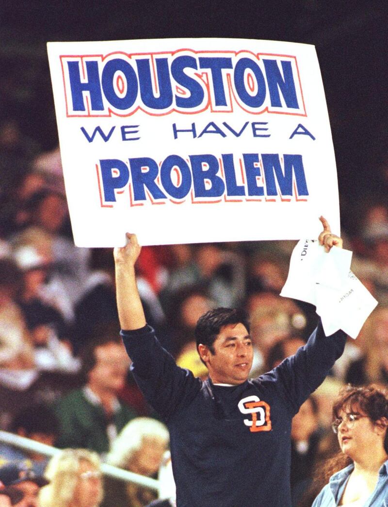 A San Diego Padres’ fan holds up a sign with a popular line from the film Apollo 13. Photograph: Vince Bucci/AFP via Getty