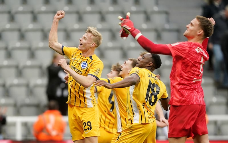 Brighton's Jan Paul van Hecke (left) and team-mates celebrate after the game. Photograph: Owen Humphreys/PA