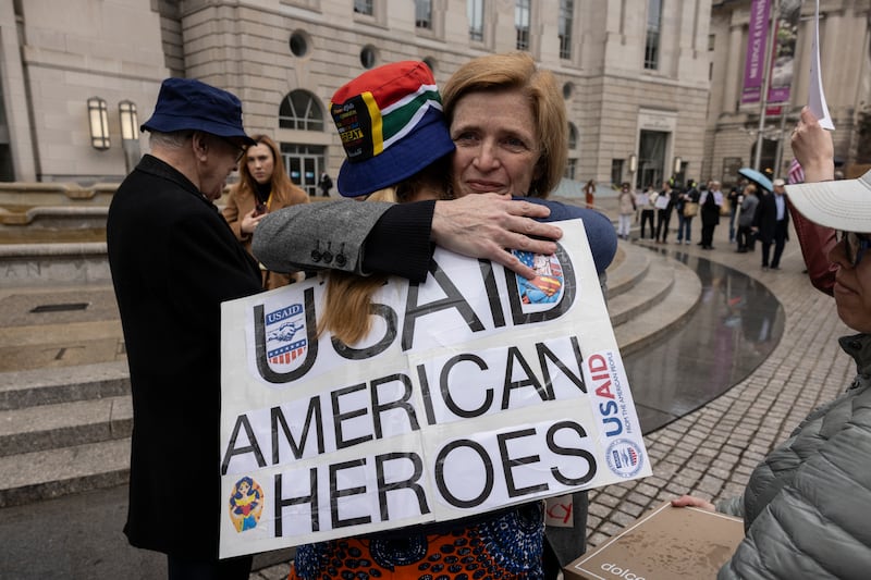 Samantha Power, a former administrator of USAID under President Joe Biden, hugs a supporter as USAID employees gathered their personal belongings from the Ronald Reagan Building in Washington, DC, on Thursday. Elon Musk’s effort has effectively shut down the agency. Photograph: Anna Rose Layden/New York Times