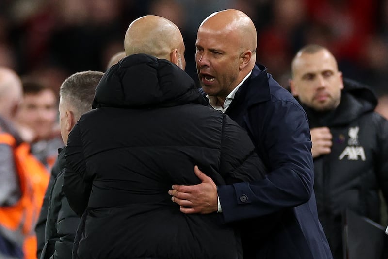 Liverpool's Dutch manager Arne Slot talks to Manchester City's Spanish manager Pep Guardiola following the English Premier League football match between Liverpool and Manchester City at Anfield. Photograph: Adrian Dennis/AFP