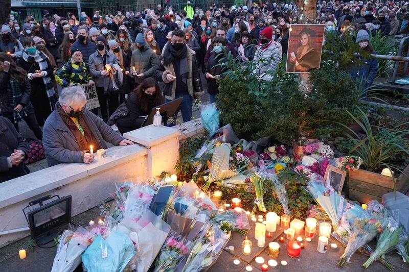 People hold a vigil outside the London Irish Centre in Camden. Photograph:  Dominic Lipinski/PA Wire