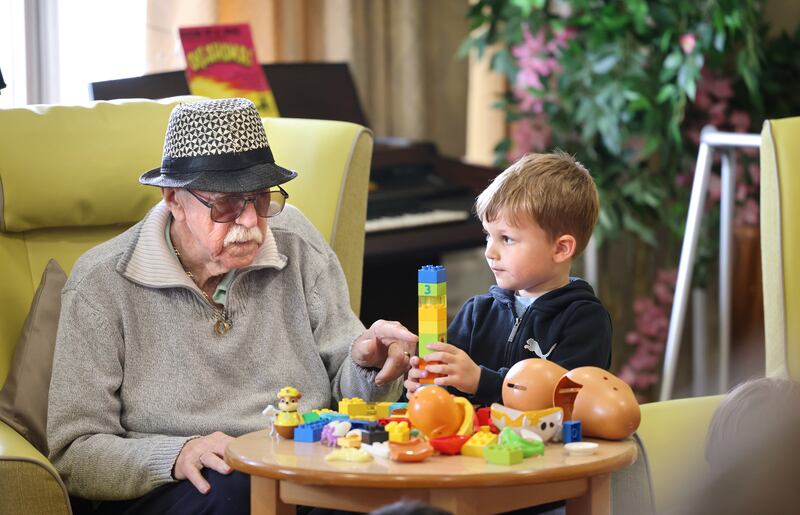 John Donohoe at Silver Stream Nursing Home enjoys time with Troy from Happy Days. Photograph: Dara Mac Dónaill 







