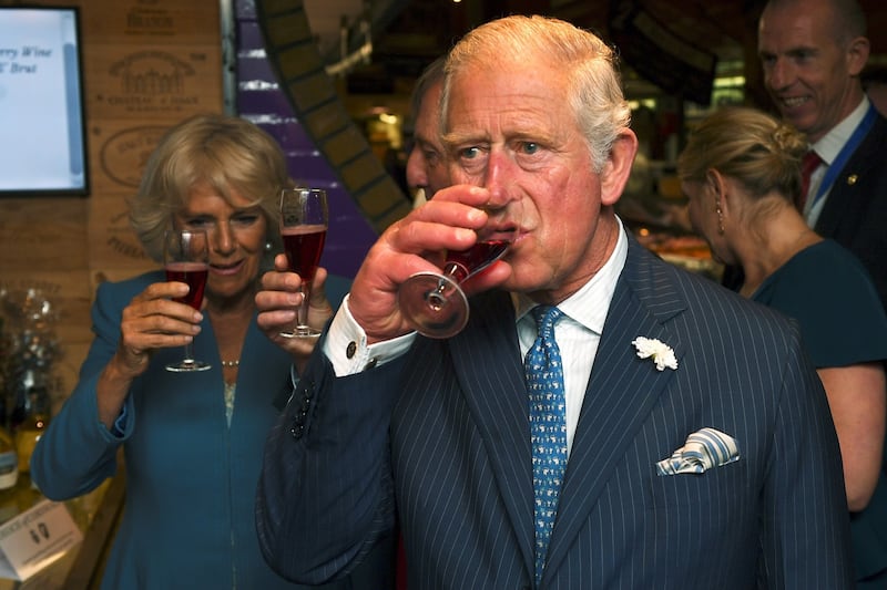 Charles and Camilla raise a glass of during their visit to the English Market in Cork. File photograph: Clodagh Kilcoyne/Reuters