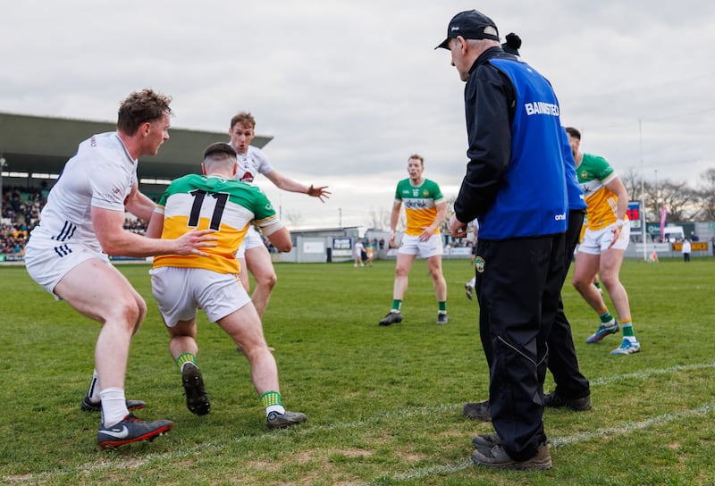 Mickey Harte and Declan Kelly engrossed in the action when Offaly took the field against Kildare. Photograph: James Crombie/Inpho 
