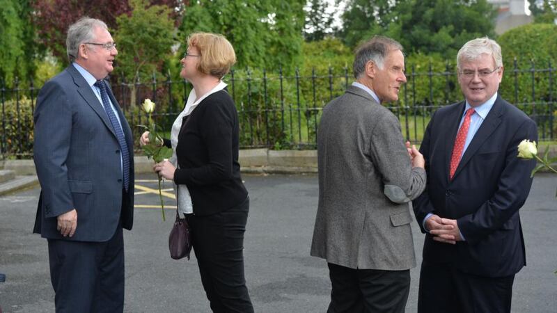 Minister for Communications Pat Rabbitte, former USIT staff member Mary O’Driscoll, a former travel business colleague of Gordon Colleary’s John Dawson, and Tánaiste Eamon Gilmore at the funeral of Gordon Colleary, founder of USIT, in St. Joseph’s Parish Church, Glasthule, Dublin. Photograph: Alan Betson/The Irish Times.