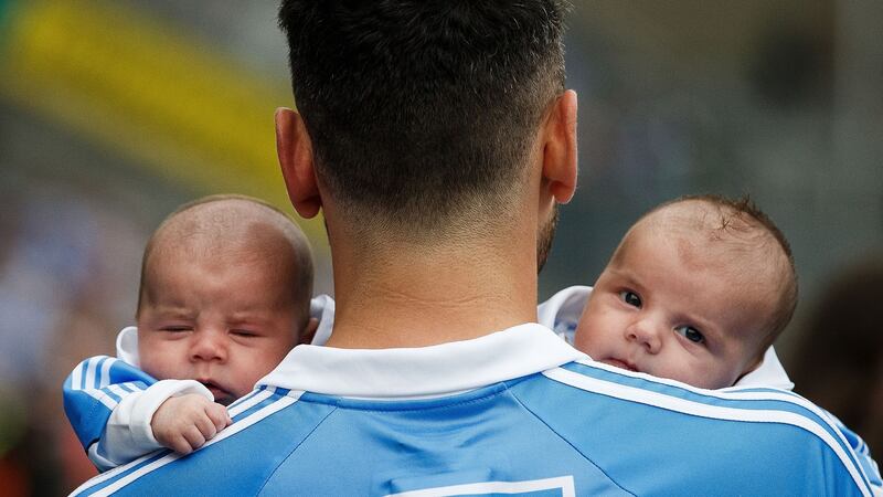 Bernard Brogan celebrates after the game with his sons Keadan and Donagh Brogan (8 weeks old). Photo: Tommy Dickson/Inpho