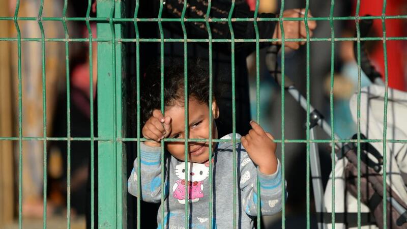 Syrians migrants wait inside a temporary centre for immigrants and asylum seekers in the Spanish enclave of Melilla. Photograph: Fadel Senna/AFP/Getty Images