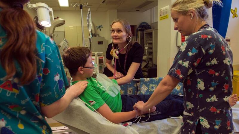 Dr Carol Blackburn, emergency department consultant, with  patient Pat Taaffe, in Our Lady’s Children’s Hospital in Crumlin, Dublin. Photograph: Brenda Fitzsimons