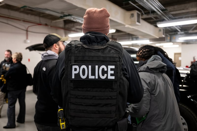 US Immigration and Customs Enforcement  agents, along with other federal law enforcement agencies, attend a pre-enforcement meeting in Chicago on Sunday. Photograph: Christopher Dilts/Bloomberg