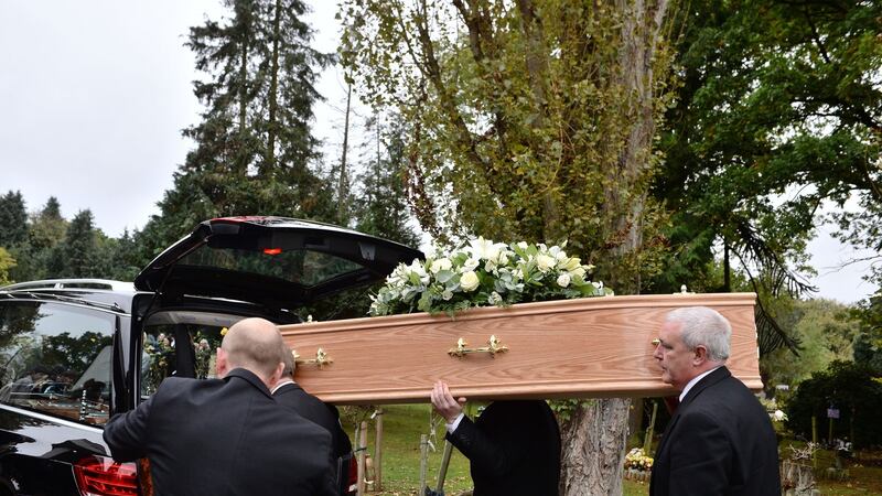 The coffin of Sean Hughes is carried into the chapel at Islington and Camden Cemetery in London. Photograph: John Stillwell/PA Wire