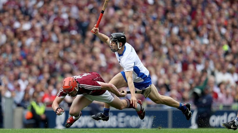 Galway’s Conor Whelan is challenged by Jamie Barron of Waterford. Photograph: Tommy Dickson/Inpho