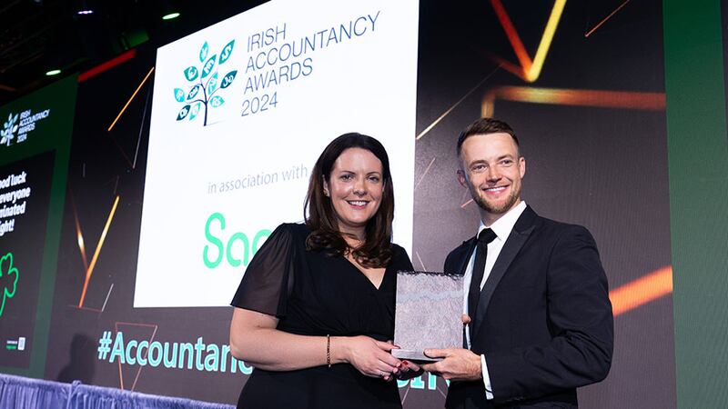 Avril McArdle, customer marketing director, Sage, presents the best use of technology in accountancy & finance award to the Jano Rademan, Teybridge Capital (Europe)