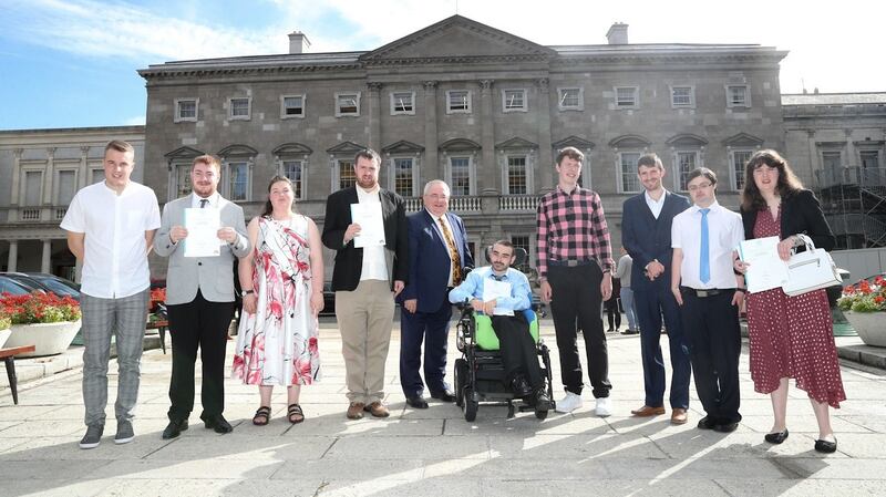 Graduates of the Oireachtas Work Learning (OWL) programme outside Leinster House. Photograph: Maxwells Owl graduates celebrate outside Leinster House