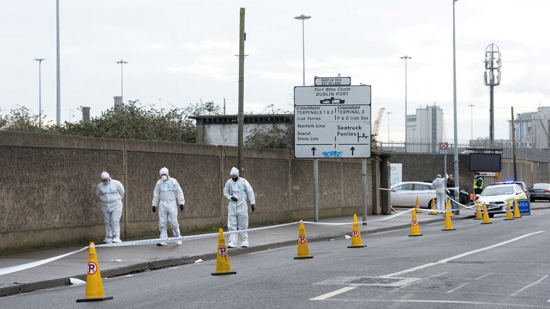 Garda forensic inspect the scene of a knife assault on East Wall Road, Dublin, where a teenage boy died. Photograph: Dara Mac Dónaill / The Irish Times